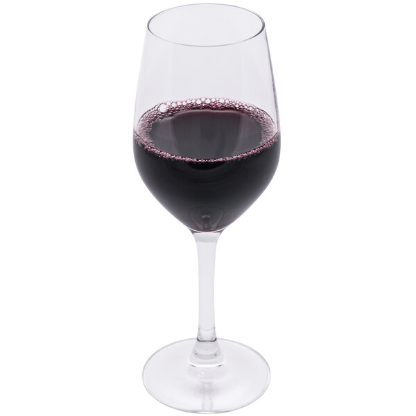 An Arcoroc wine glass filled with red wine.
