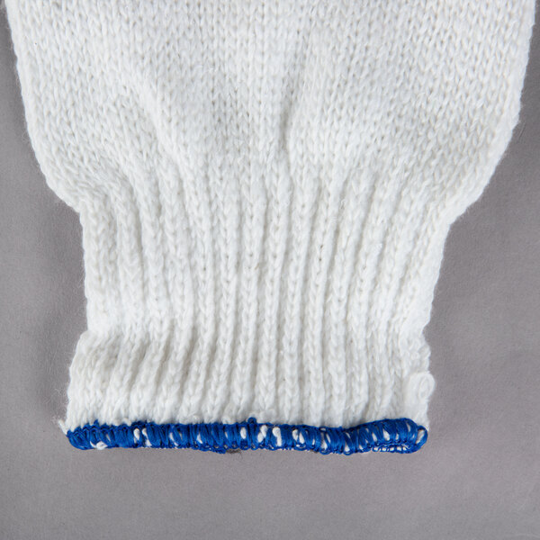 A white knitted glove with blue trim at the wrist.