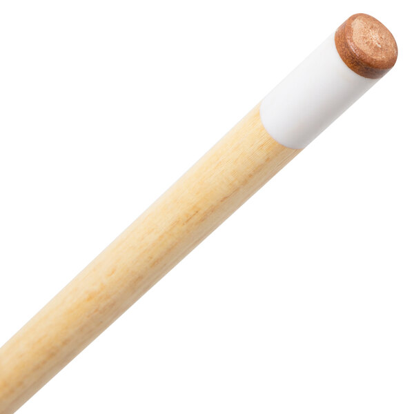 A close up of a brown Mizerak shorty cue stick with a white tip.