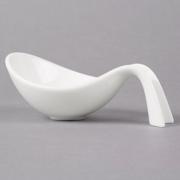 A white Villeroy & Boch porcelain bowl with a curved handle.