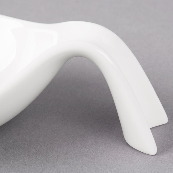 A white Villeroy & Boch porcelain amuse bouche bowl with curved edges.