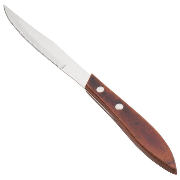 A Walco stainless steel steak knife with a Pakka wood handle.