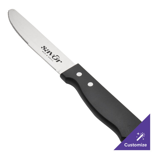A Walco stainless steel steak knife with a black handle.