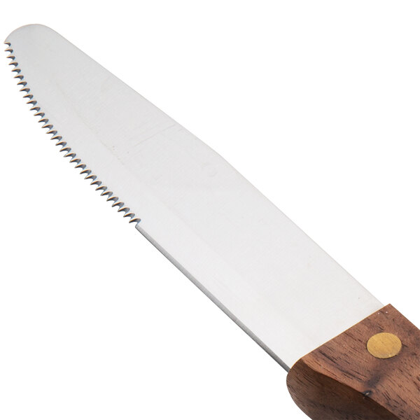 A Walco stainless steel steak knife with a stained hardwood handle.