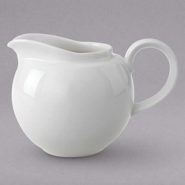 A Villeroy & Boch white porcelain creamer with a handle.