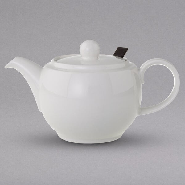 A Villeroy & Boch white porcelain teapot with a lid.