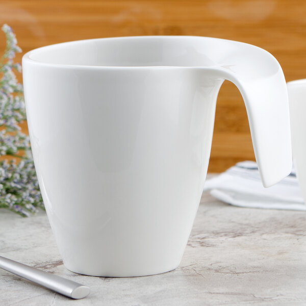 A white Villeroy & Boch porcelain mug with a handle.