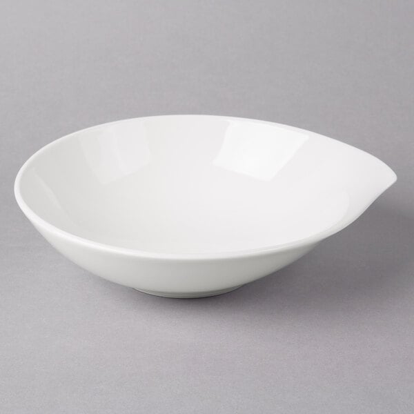 A white Villeroy & Boch porcelain bowl on a gray surface.