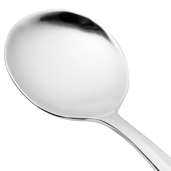 A close-up of a Walco stainless steel bouillon spoon with a silver handle.