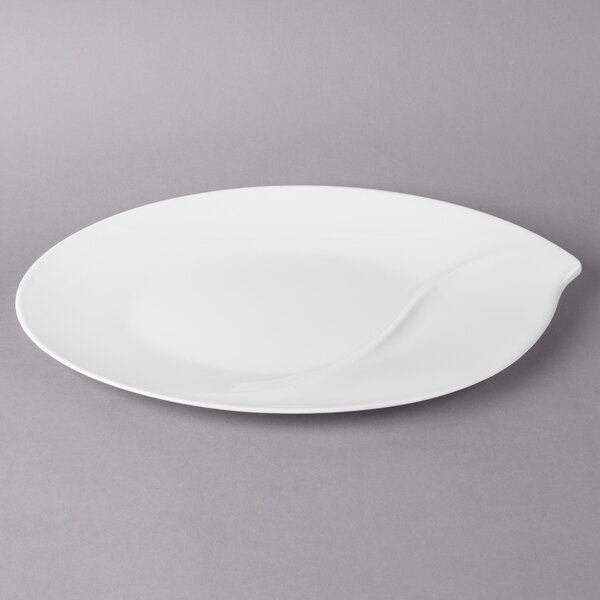 A white Villeroy & Boch oval platter with a curved edge.