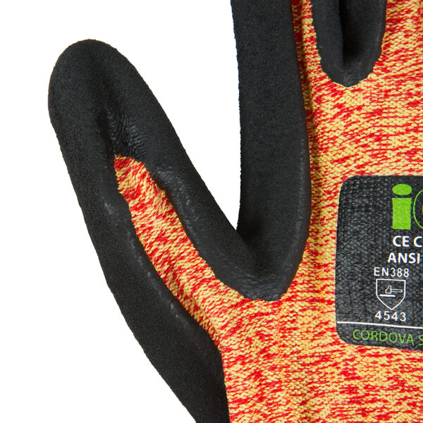 A pair of extra large Cordova heavy duty work gloves with a black and orange design.