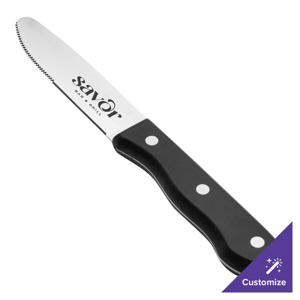 A Walco steak knife with a black Delrin handle.