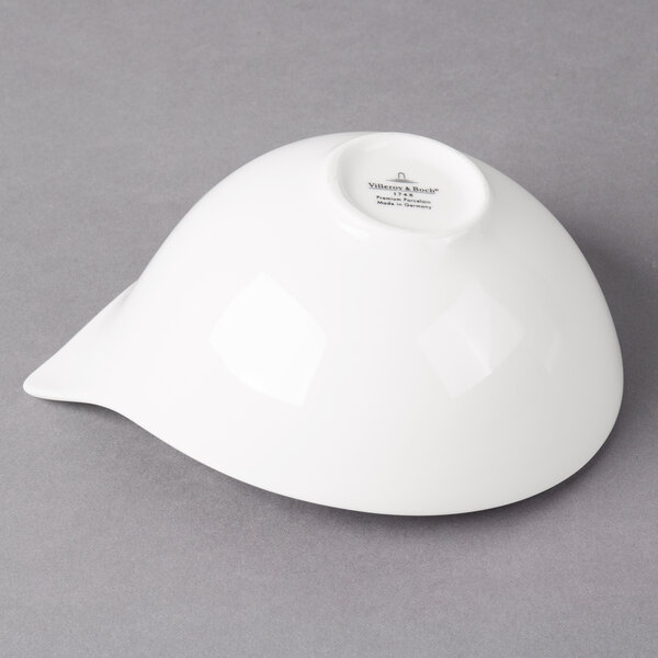 A white Villeroy & Boch porcelain bowl on a gray surface.