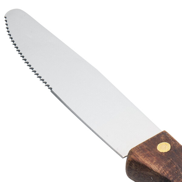 A Walco stainless steel steak knife with a dark hardwood handle.