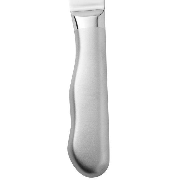A close up of a Walco stainless steel steak knife with a frost finished hollow handle.