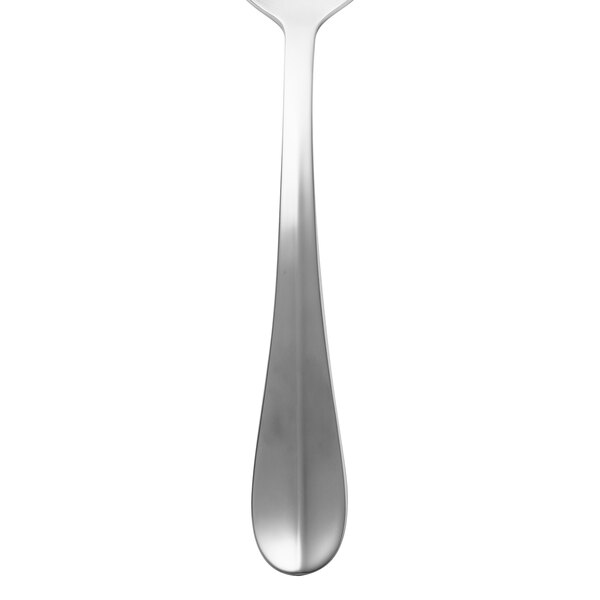 A silver Walco Lancer stainless steel serving spoon with a white background.