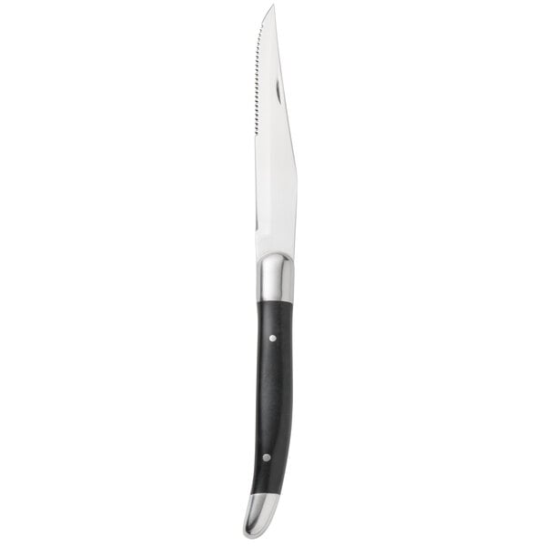 A Walco stainless steel steak knife with a black plastic Delrin handle.