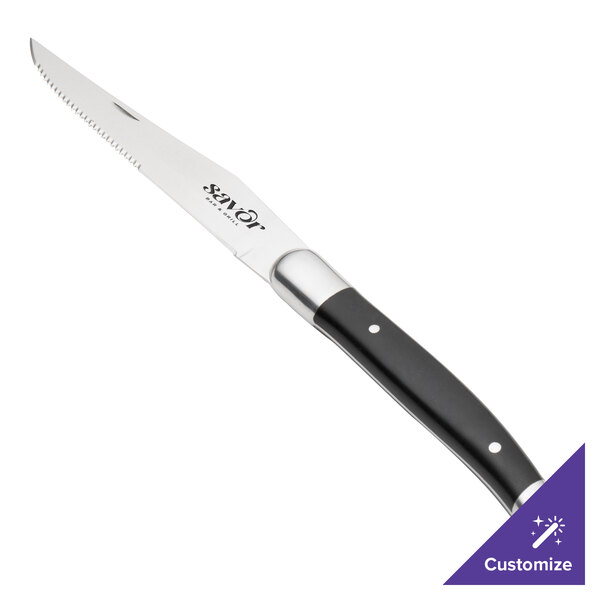 A Walco stainless steel steak knife with a black Delrin handle.