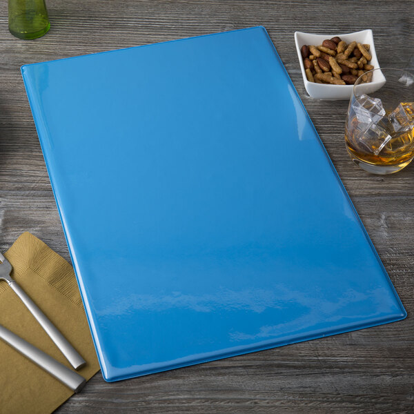 A blue Menu Solutions folder on a table with a menu inside.