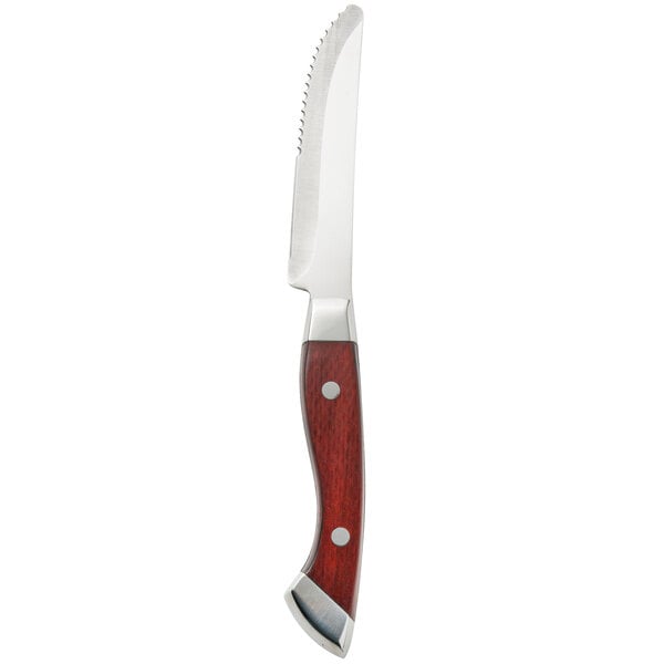 A Walco stainless steel steak knife with a wooden handle.