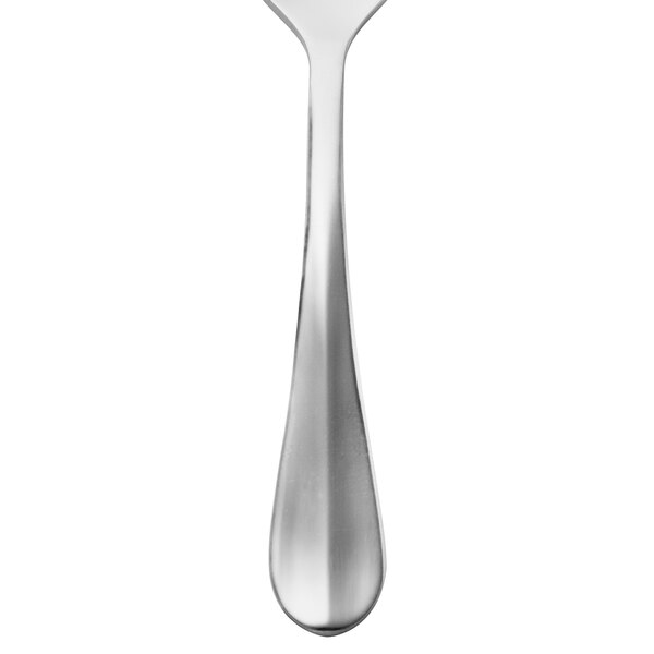 A Walco stainless steel demitasse spoon with a white background.