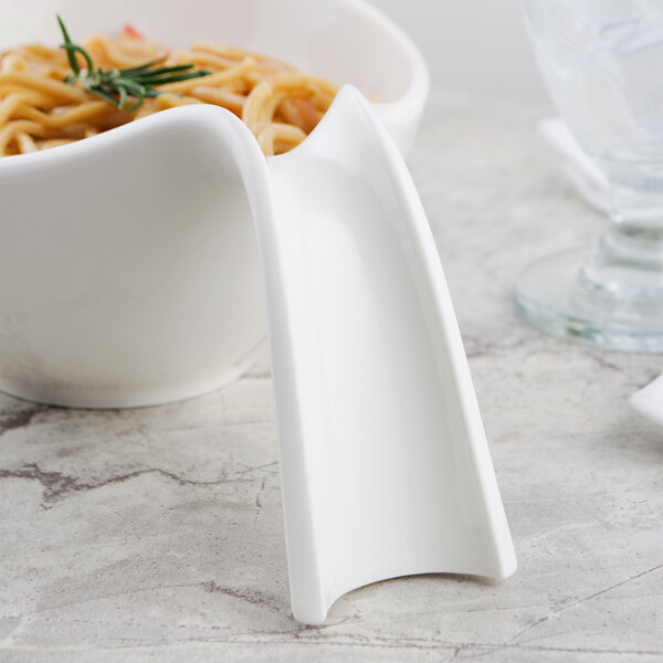 A Villeroy & Boch white porcelain handled bowl with spaghetti and a fork.