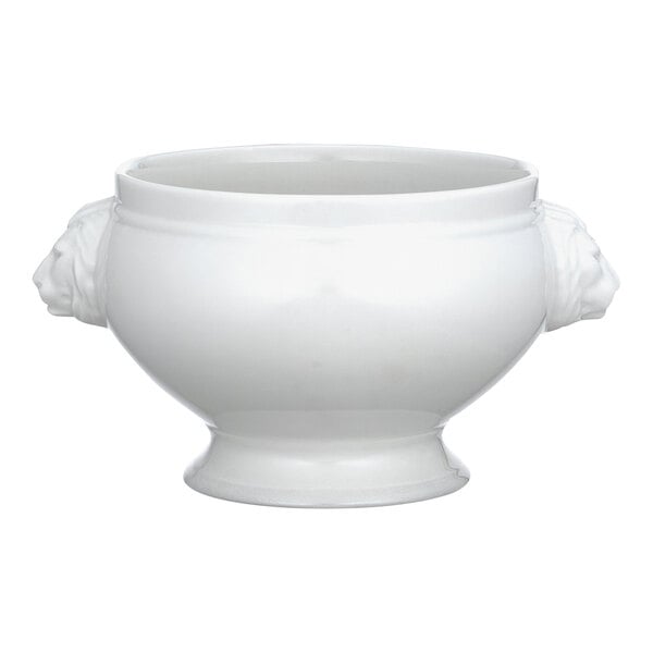 A white Villeroy & Boch porcelain bowl with lion heads on the base and a handle on top.