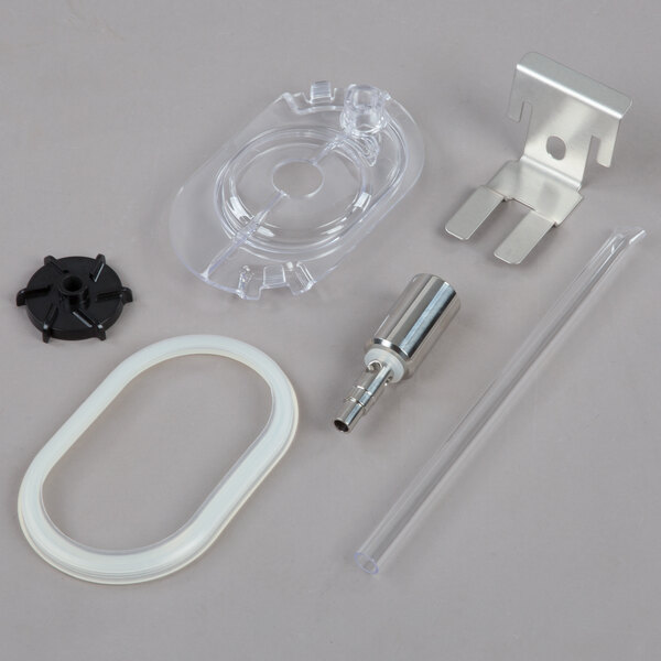 A white plastic Crathco beverage dispenser bowl assembly with metal and glass parts.