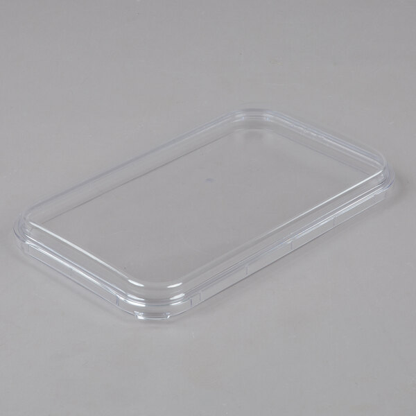 A clear plastic bowl with a lid for a Crathco beverage dispenser.