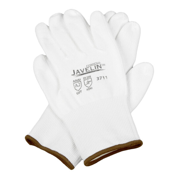 A pair of white Cordova Javelin HPPE and synthetic fiber gloves with a white polyurethane palm coating and brown trim, size medium.