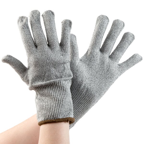 A pair of Cordova Monarch gray and white gloves.
