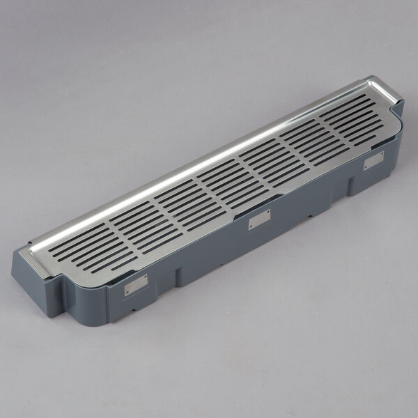 A silver metal rectangular object with holes.
