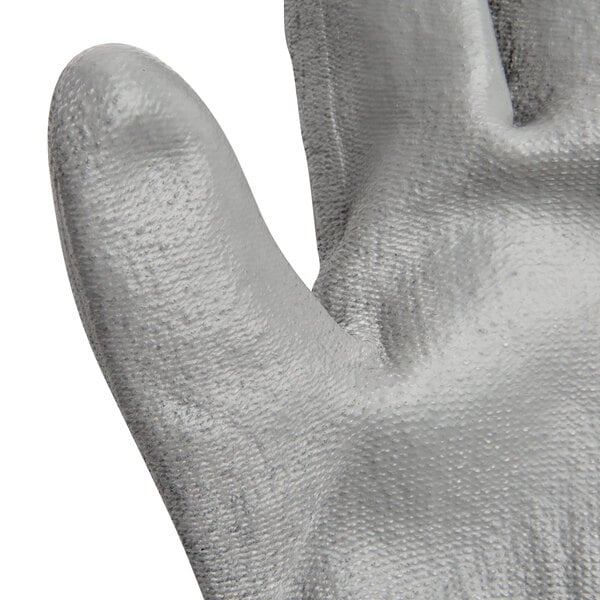A pair of Cordova gray gloves with a gray palm coating.