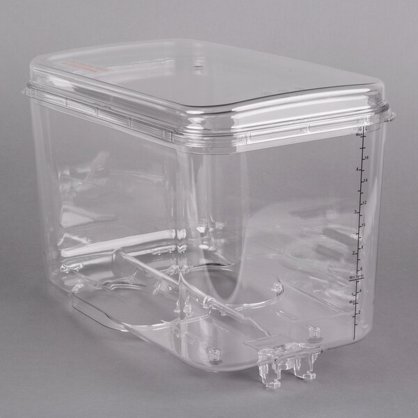 A clear plastic bowl with a lid for a Crathco refrigerated beverage dispenser.