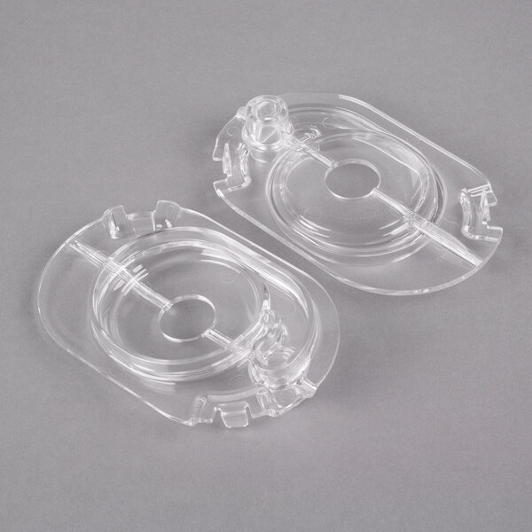 A clear plastic container with a hole in it.