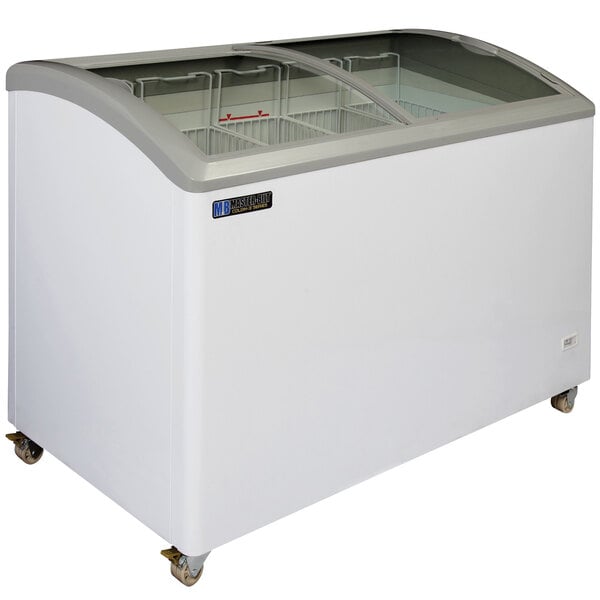 A white Master-Bilt curved top display freezer with glass doors.