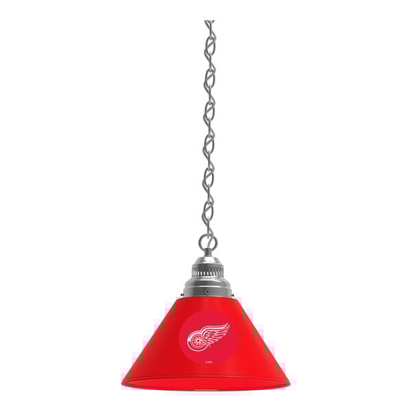A red lamp shade hanging from a chain with the Detroit Red Wings logo on it.