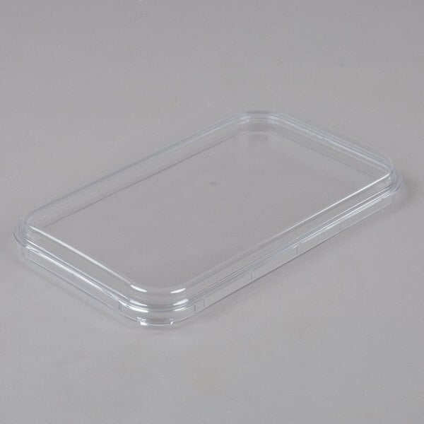 A clear plastic bowl with a lid on a Crathco refrigerated beverage dispenser.