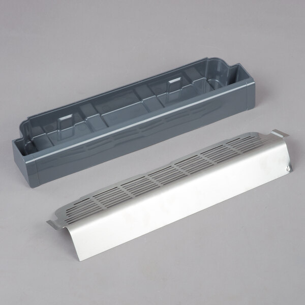 A grey plastic container with a white cover and a pair of grey plastic trays.