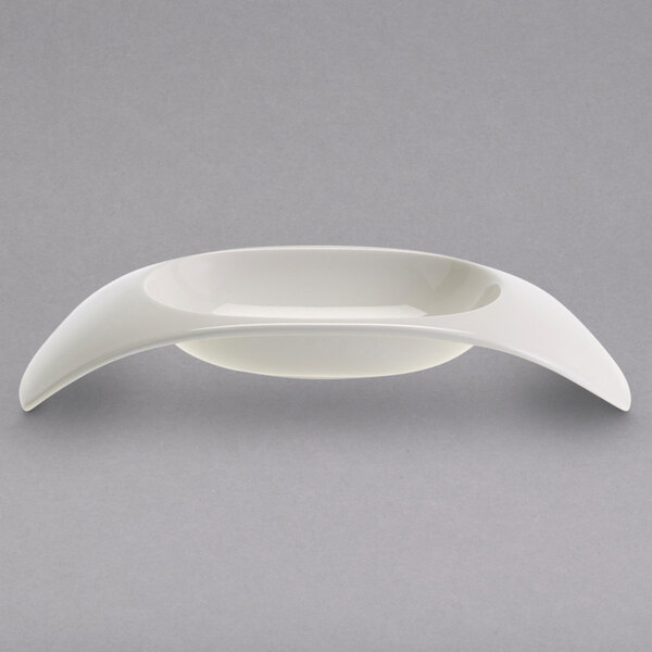 A white Villeroy & Boch pasta bowl with curved edges.