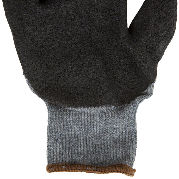 A close up of a black and gray Cordova glove.