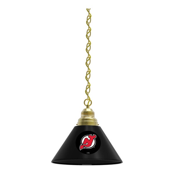A black lamp shade with a gold New Jersey Devils logo on it.