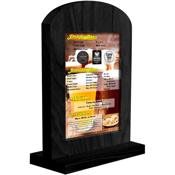 A Menu Solutions black arched wood menu tent on a table with a beer menu.