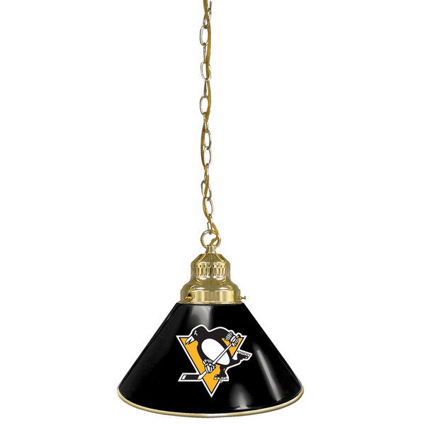 A brass pendant light with a Pittsburgh Penguins logo on the lamp shade.