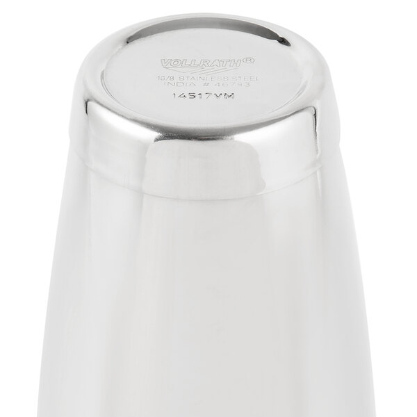 A Vollrath stainless steel full size cocktail shaker tin on a counter.