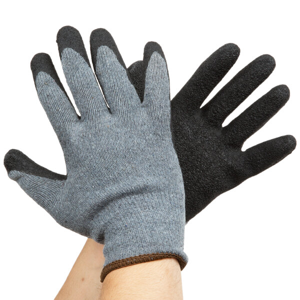 A pair of hands wearing Cordova gray gloves with black latex palms.