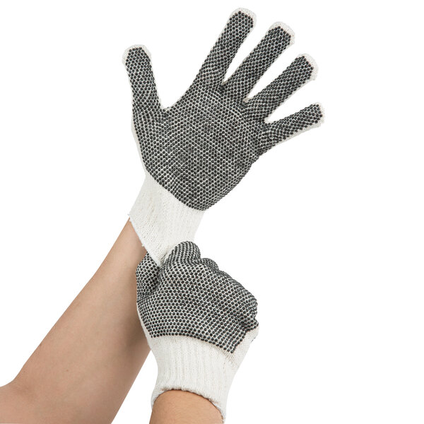 A pair of Cordova work gloves with black PVC dots on white cotton.