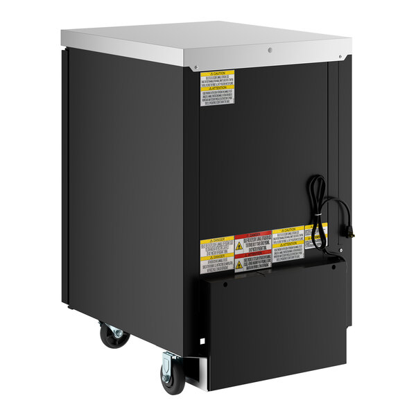 A black counter height back bar refrigerator with a glass door, caster wheels, and visible warning labels.