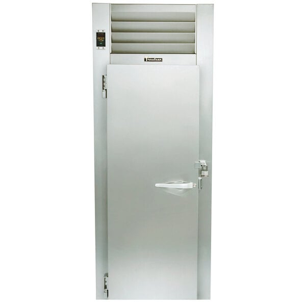 The stainless steel door of a Traulsen Correctional Roll-In Heated Holding Cabinet with a metal handle.