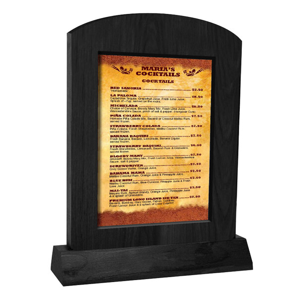 A Menu Solutions black arched wood menu tent with angled base holding a menu.